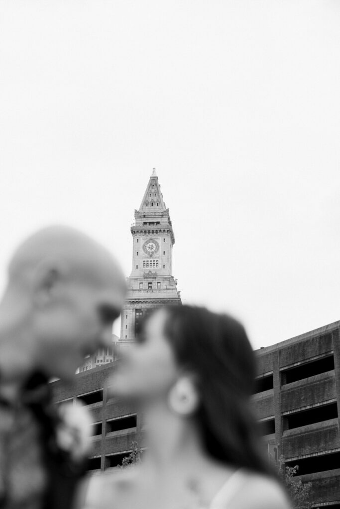 A couple's silhouette with the iconic Custom House Tower in the background.