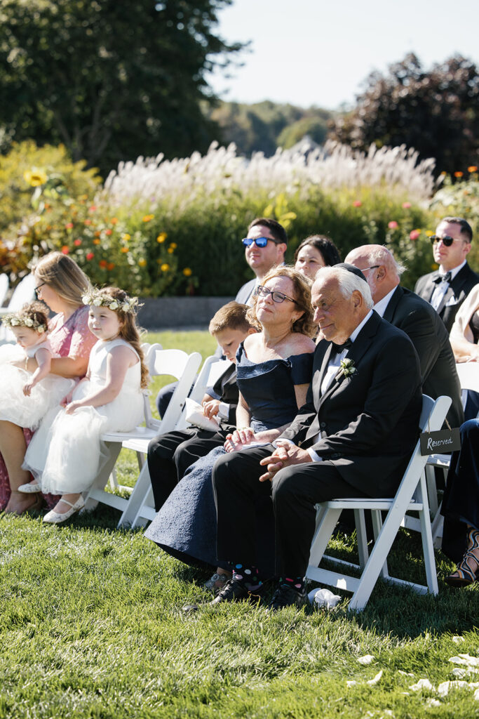 Wedding guests listening to vows
