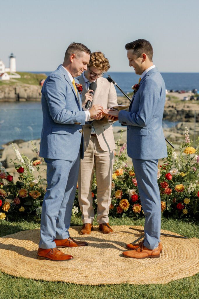 Two people exchanging rings during their wedding ceremony. 